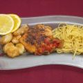 Linguine con scampi, pomodori e zucchini in[...]