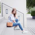 Skinny Ankle Jeans & Braided Shoulder Bag